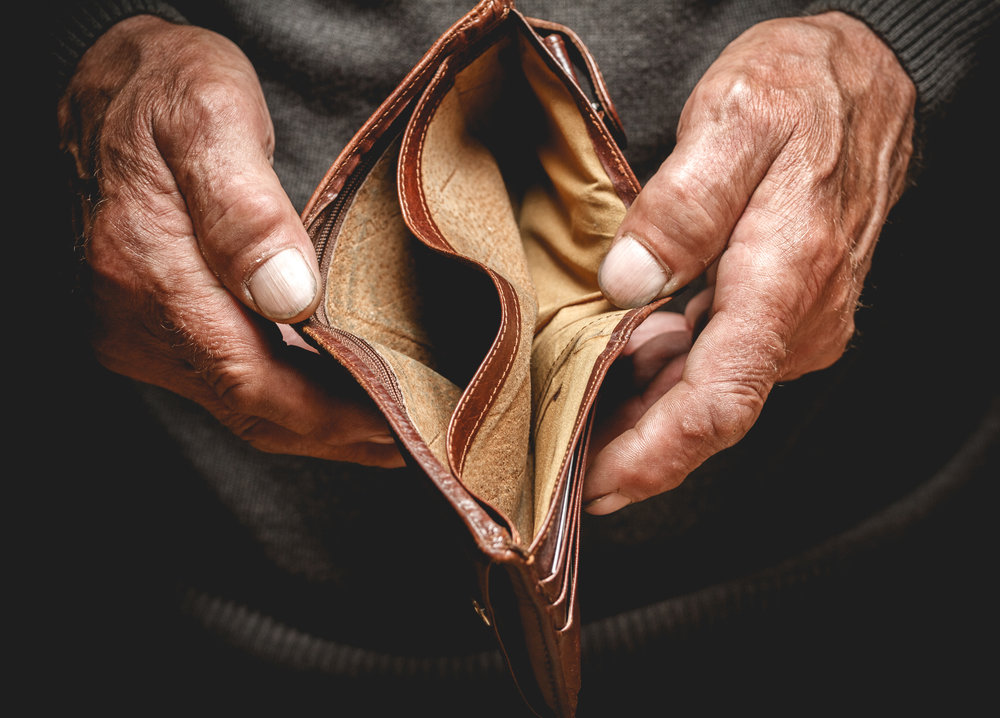 Man showing his empty wallet